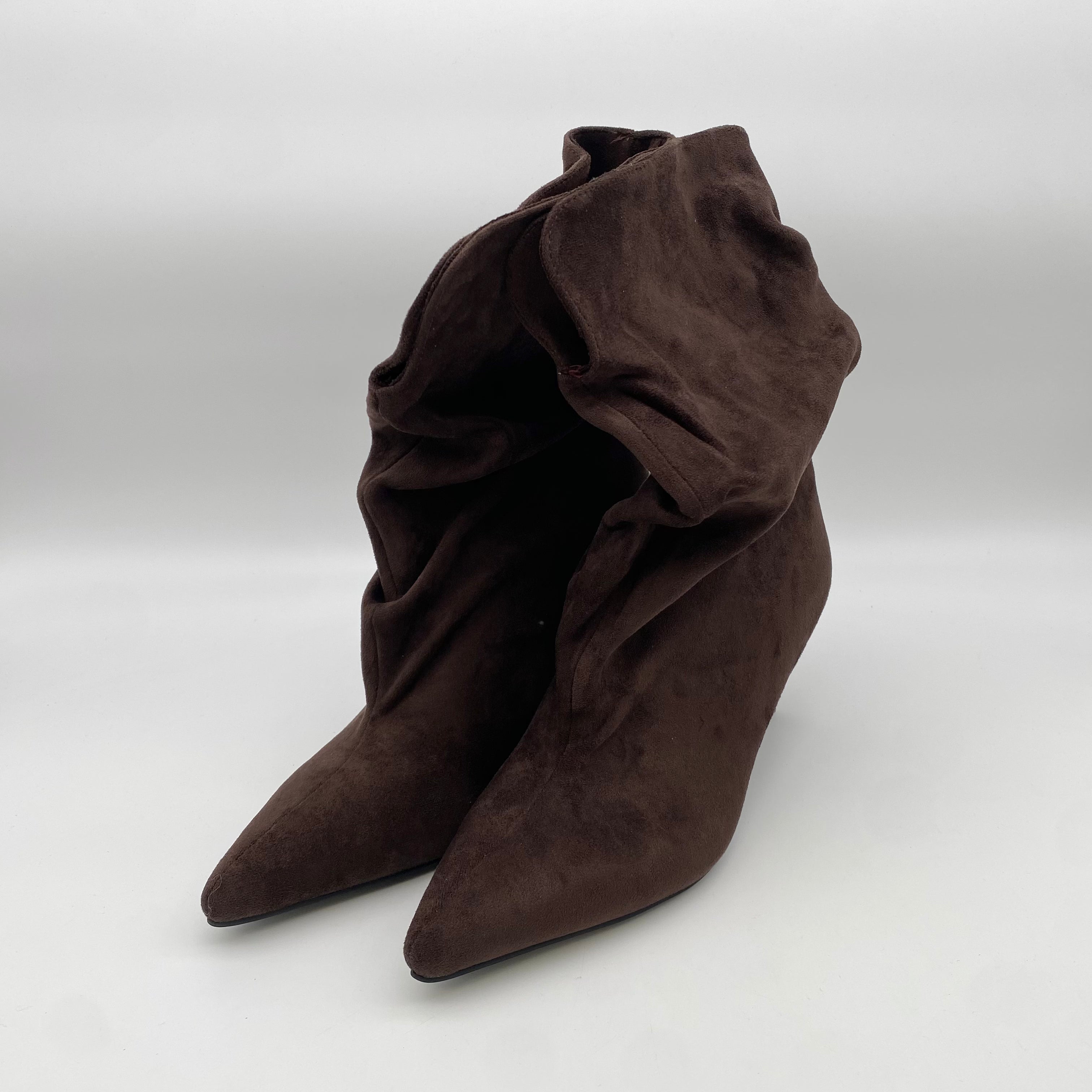 Pointy Boots Sued